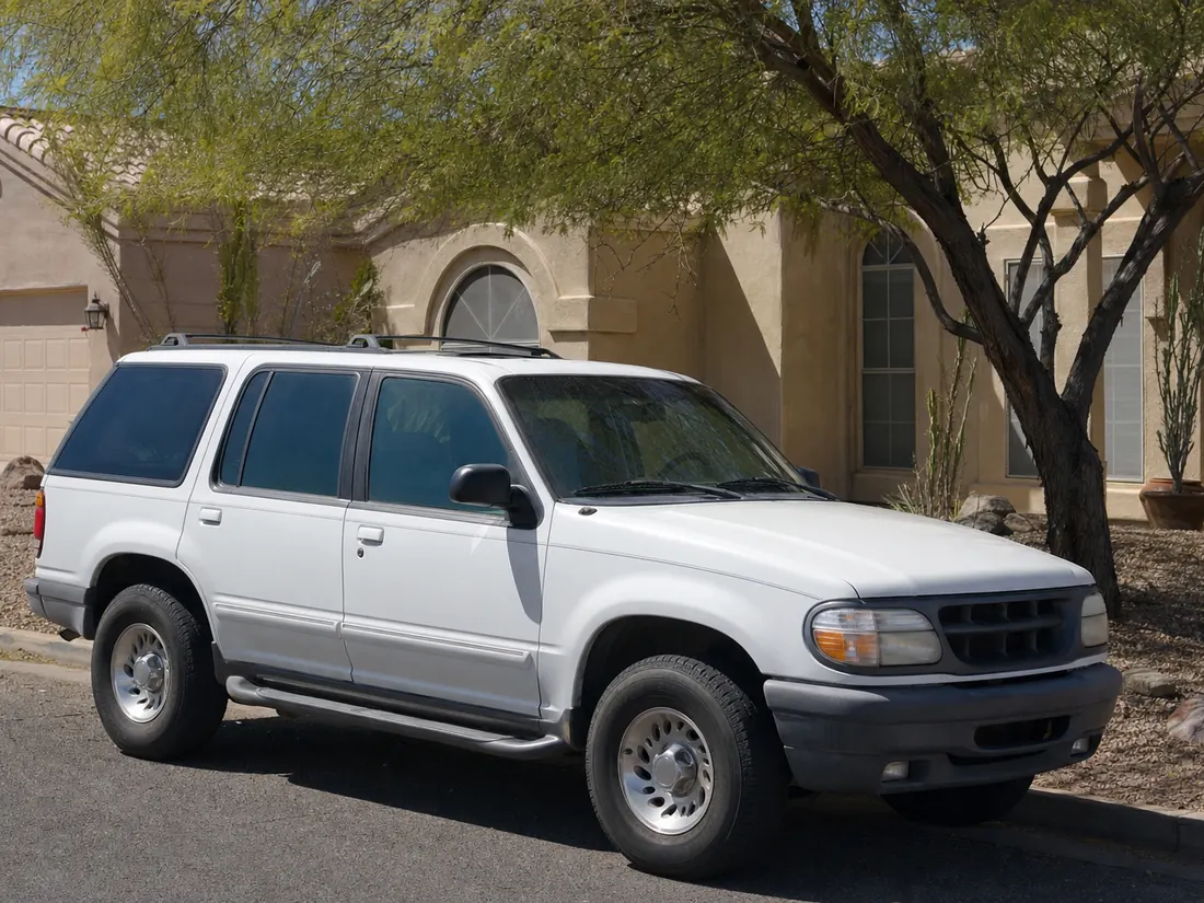 SUV parked at a San Antonio home with desert landscaping, ready for sale